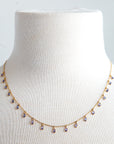 125J- 18kt Gold Necklace w Tanzanite