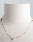125J- 18kt Gold Necklace w Tanzanite